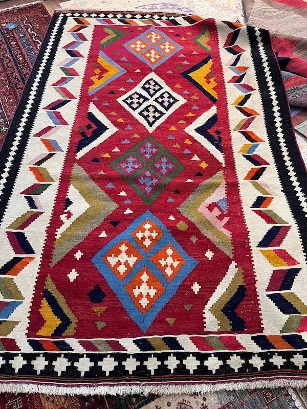 Colourful geometric patterned woven rug
